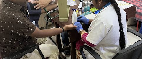 Blood Donation- 77th Foundation Day Doctor Examining a Donor